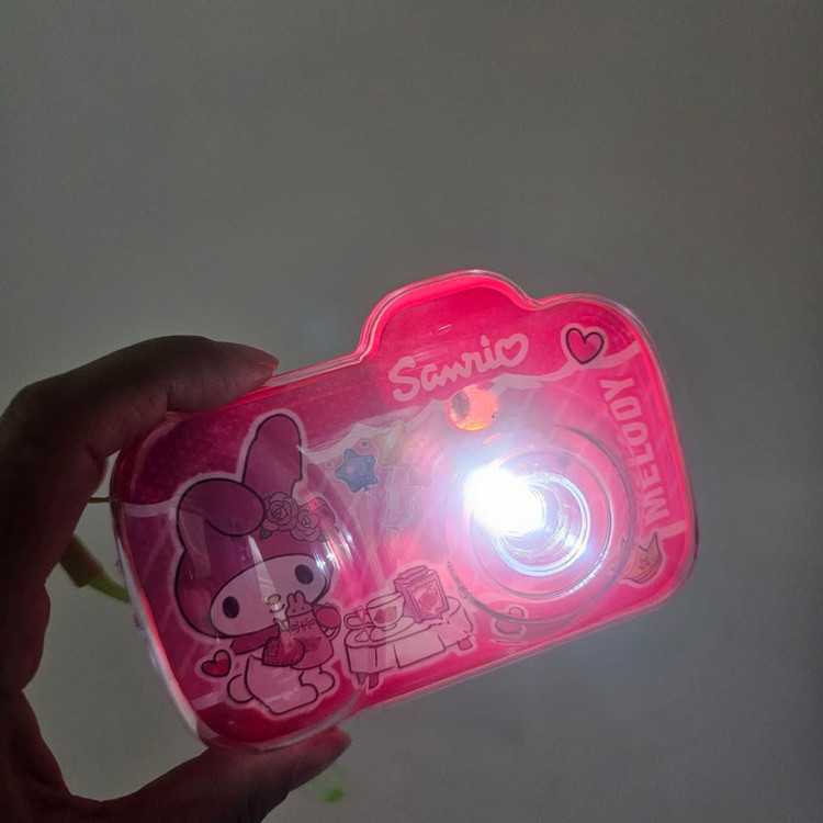 اسباب بازی ناب سل مدل دوربین پروژکتوری ملودی چراغدار به همراه 15 طرح کارتونی کد MELODY PROJECTOR CAMERA NAAB003
