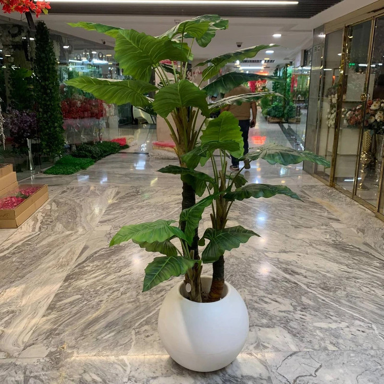 درختچه مصنوعی بابا آدم با برگ قابل شستشو، 3 تنه، ابعاد 20x20x180 سانتیمتر، وزن 15000 گرم، مناسب فضای باز و گلهای آپارتمانی، بدون گلدان