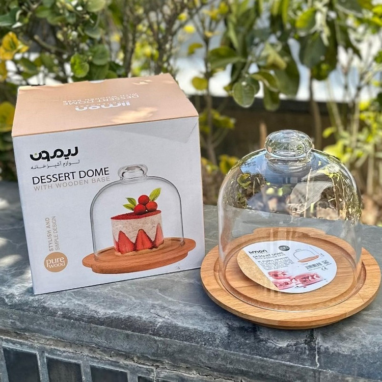 ظرف سرو پنیر پایه چوبی با درپوش شیشهای شفاف، ابعاد 17.5×17.5×16، وزن 500 گرم، مناسب شستشو با دست، فرم دایرهای